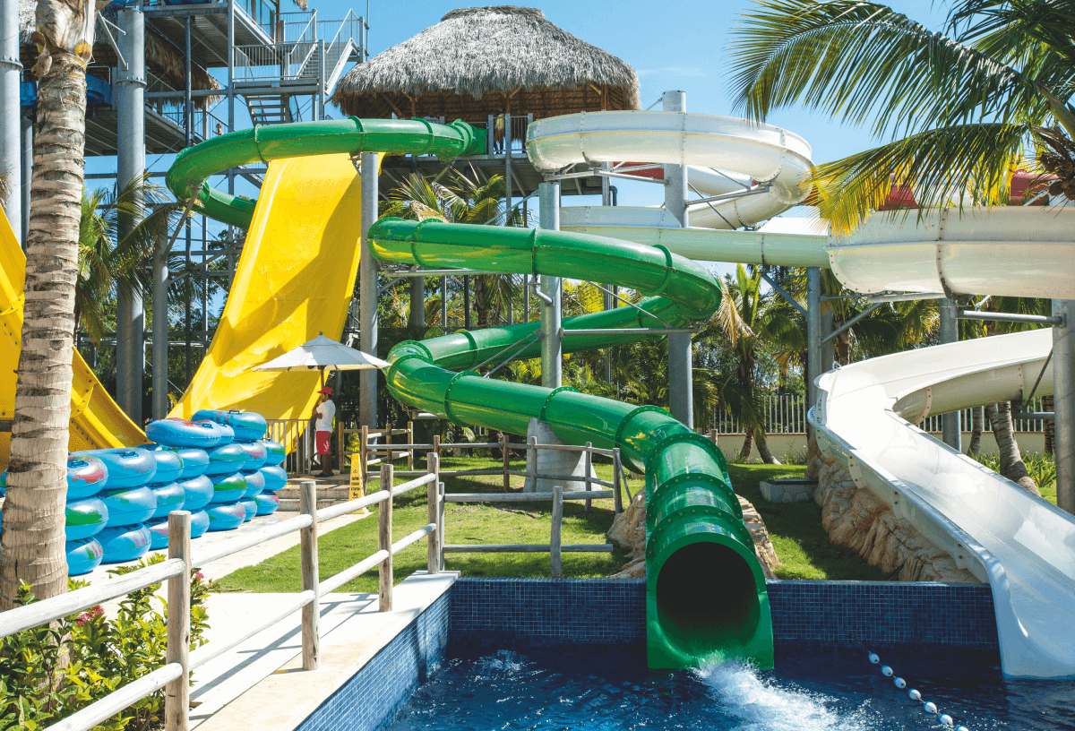 A tropical photo of three of the slides at Royalton Splash Punta Cana